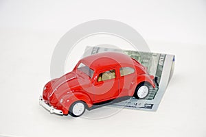 Red retro car and dollars