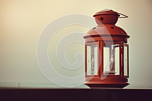 Red retro lamp at terrace with sunset light , vintage style