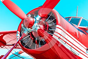 Red retro propeller engine airplane