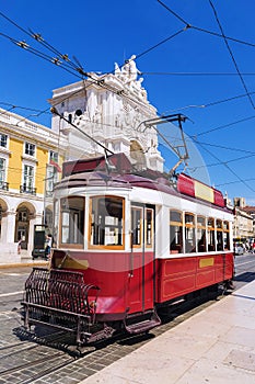 Red retro tram Commerce Square in Lisbon