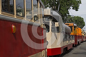 Red retro trams on a city road