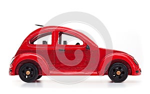 Red retro wooden toy car isolated on white background