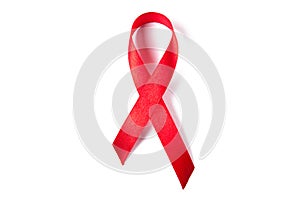 Red ribbon as symbol of aids awareness isolated on white