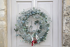 Red Ribbon and Bell on Christmas Wreath