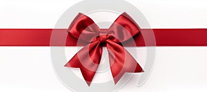Red ribbon bow on white background for birthday or christmas banners with customizable text space.