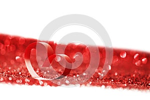 Red ribbon heart on glitters