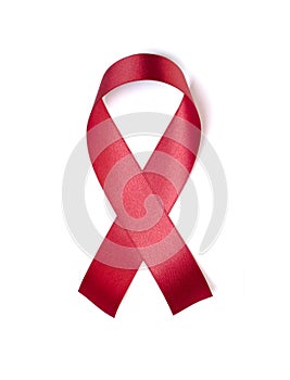 Red ribbon isolated on white background Photo object for sign world aids day