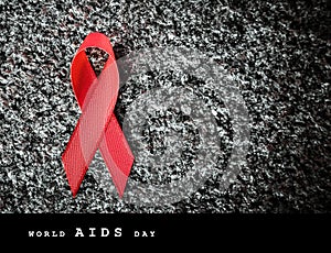 Red ribbon red ribbon on a stone, world aids day concept