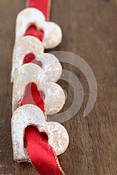 Red ribbon with shortbread hearts