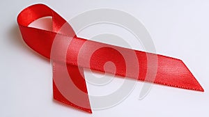 The red ribbon symbolizing awareness and support for important health causes..AI generated image