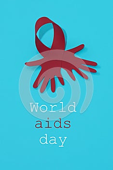 Red ribbon and text world aids day