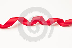 Red ribbon to make ties in Christmas gifts