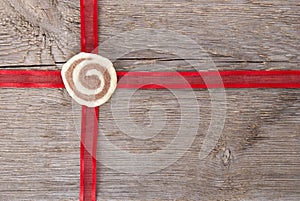 Red ribbon on wood