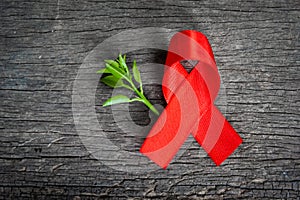 Red ribbon for world aids day awareness campaign background
