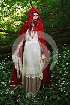 Red riding hood in a green forest