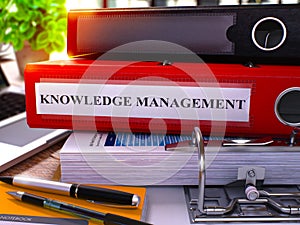 Red Ring Binder with Inscription Knowledge Management. 3D.