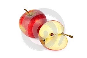 Red ripe apple with fresh sliced apple piece isolated on white