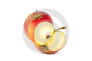 Red ripe apple with fresh sliced apple piece isolated on white