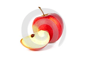 Red ripe apple with fresh sliced apple piece isolated on white