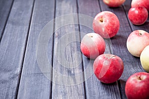 Red ripe apples on wooden table background copy space photo