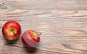 Red ripe apples on a wooden table. Fruit apples on the old board