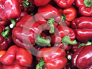 Red ripe bell peppers consist of capsaicin compound, red chilli texture or background, sell in market shelf for ingrediant cooking photo