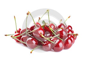 Red, ripe, fresh cherries on a white background.