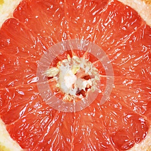 Red ripe grapefruit slice background