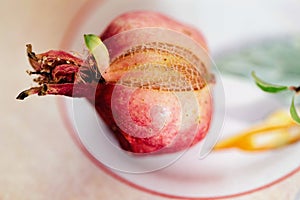 Red ripe pomegranates on plate background, Copy space, top view.