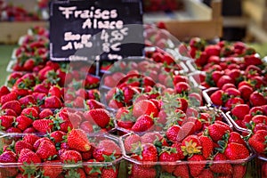Red ripe strawberries on display at a farmers market, Strasbourg, France