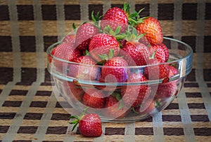 Red ripe strawberries in a glass Cup