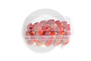 Red ripe strawberry in plastic box of packaging