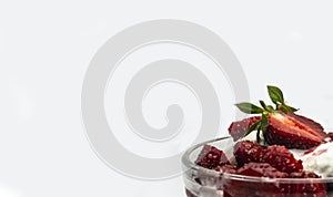 Red ripe sweet strawberries with ice cream in a ice-cream bowl on a white background