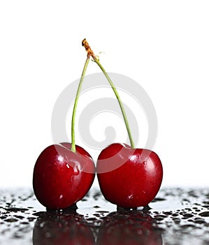 Red ripe cherries on a white background