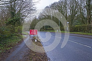 A Red Road Ahead Closed Sign