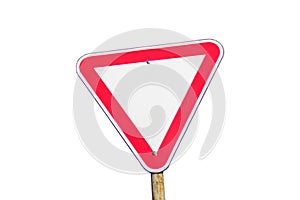 Red road sign isolated. Defocus blank empty triangle red warning road sign with blue sky background. Danger direction