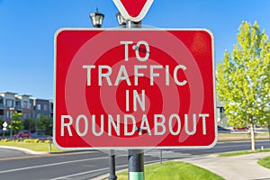 Red roadsign with white To traffic in roundabout at Daybreak in South Jordan, Utah