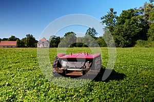 Red robotic lawn mower