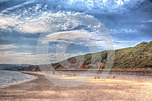 Red rock beach Dawlish Warren Devon England on a summer day in HDR