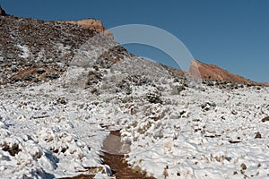 Red rock buttes with snow in the high desert