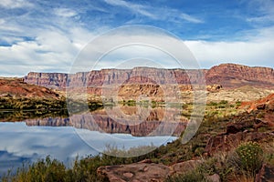 Red rock cliffs reflction on Colorado river near Lees Ferry AZ