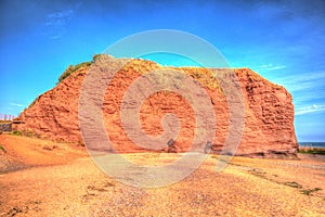 Red rock Dawlish Warren Devon England on a summer day in HDR