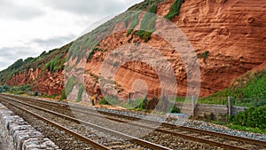 Red rock and railway in Dawlish Warren, Devon