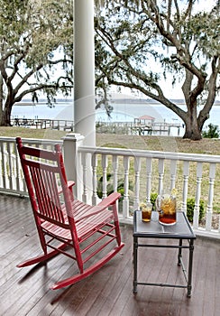 Red rocking chair and iced tea