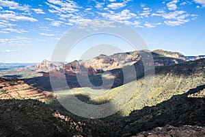 The red rocks, green valleys, and blue skies of a morning over the city of Sedona, Arizona