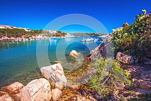 Red rocks in harbor with tourquise clear water at Porto Cervo, Costa Smeralda, Sardinia, Italy