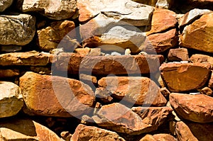 Red rocks in landscaped wall