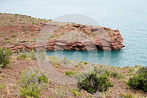 Red rocks shore of the lake