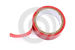 Red roll of electrical sticky isolation duct tape on white background