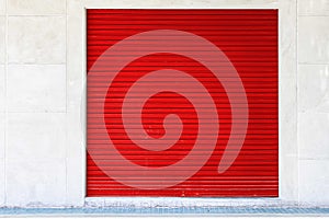 Red roller shutter door of the store is closed
